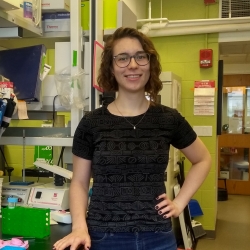 Hannah Zucker standing in front of lab bench